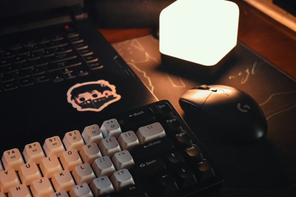 a computer keyboard sitting next to a computer mouse