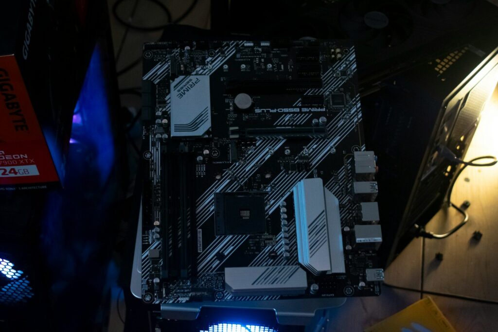 A computer motherboard sits on a surface.